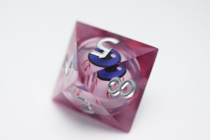 Sharp Edge Moving Eye RPG Dice Set - Bloodshot These super sharp edge dice are hand polished instead of tumbled to give them the shine without softening their edges. These dice are unique and each die in the set has a moving eye that's always looking up!  Perfect for Role Playing Games like Dungeons and Dragons (D&D), Shadowrun, Pathfinder, Warhammer, fantasy, sci-fi, or party games.   Details:  Set Type: 7 Piece RPG Set (D4, D6, D8, D10, D1%, D12, D20) Size: 16mm Material: Resin Color: Pink